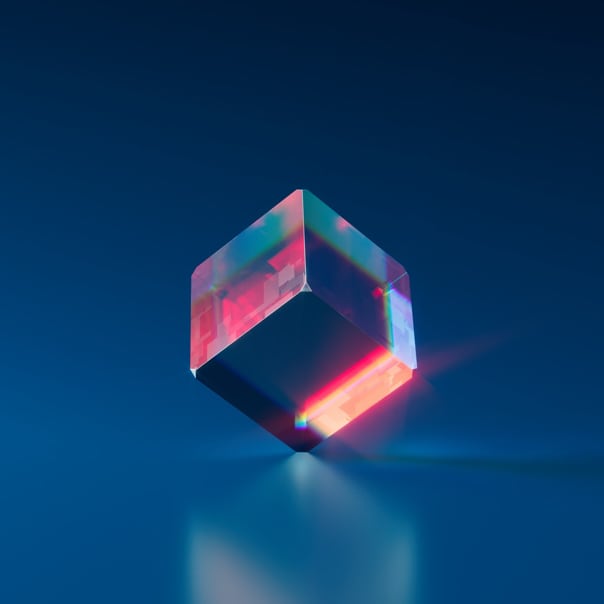 Colorful cube balanced on its edge